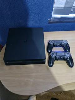 PS4 Slim + Two Controllers