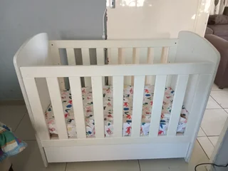 White wooden baby cot