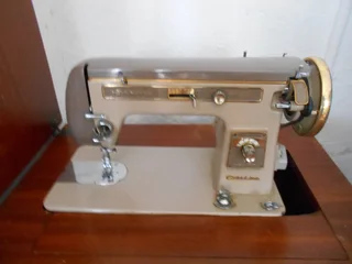 Antique Sewing machine with table / cupboard - Empisal Goldline