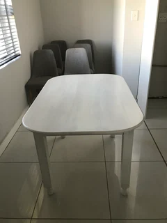 Solid wooden table, 4 seater and white washed.