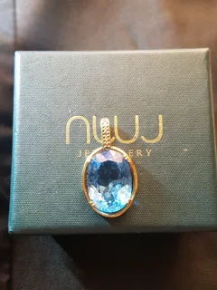 Large topaz pendant set in solid gold