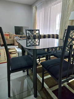 Compact 4-Seater Glass Table &amp; Chairs - Tempered Glass + Black Steel Frame