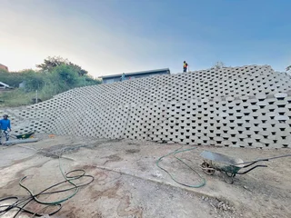 TAR DRIVEWAYS AND RETAINING WALLS