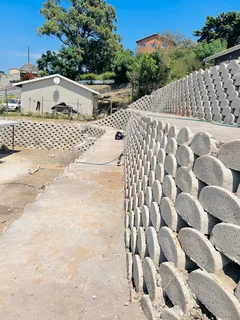 TAR DRIVEWAYS AND RETAINING WALLS