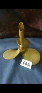 Brass propeller pen holder.