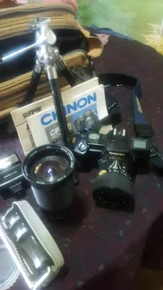 Cp 7m chinon slr camera with multiple accessories.