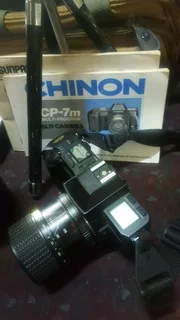 Cp 7m chinon slr camera with multiple accessories.
