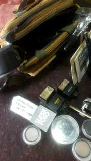 Cp 7m chinon slr camera with multiple accessories.