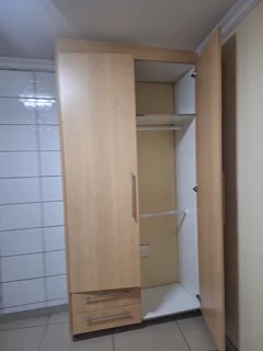 A secured room  for rental ,room with kitchenette and build -in cupboards .