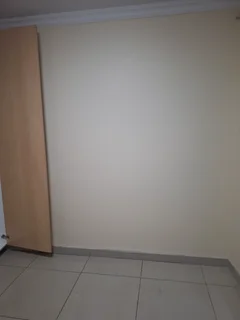 A secured room  for rental ,room with kitchenette and build -in cupboards .