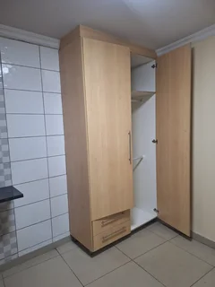 A secured room  for rental ,room with kitchenette and build -in cupboards .