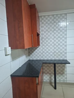 A secured room  for rental ,room with kitchenette and build -in cupboards .