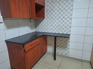 A secured room  for rental ,room with kitchenette and build -in cupboards .