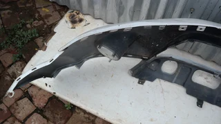 Mitsubishi Outlander front bumper with washer holes