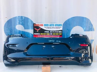 Toyota Starlet rear/back bumper with right side reflector light and pdc holes