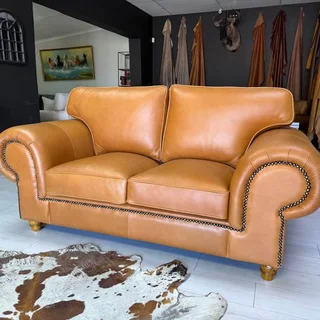 Stunning Genuine Leather Tan Balboa Two Seater available immediately &#64;R18 995.00