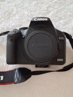 Canon EOS 500D DSLR - Body only with Battery, EOS strap, Canon charger, Manual and lens cap