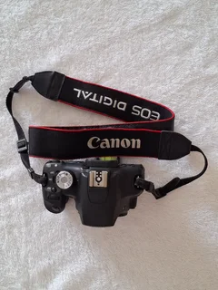 Canon EOS 500D DSLR - Body only with Battery, EOS strap, Canon charger, Manual and lens cap