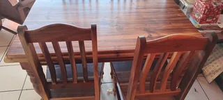 Yellow wood dining table with 4 chairs
