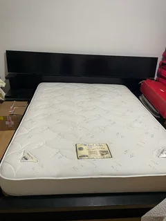 XL Queen bed with wooden base and headboard