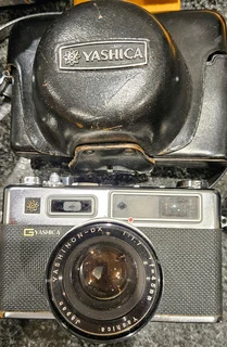 Big price DROP only 650,00 for all : 2camers ,tripod,super cool photografer leather bag,