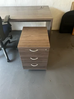 Desk, pedestal, and office chair.