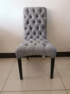 A brand new exquisite gray battoned occasional chair.