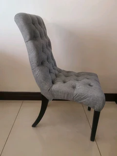 A brand new exquisite gray battoned occasional chair.