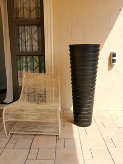 A beautiful full length designer vase, brand new slightly shop soiled. H135/W45