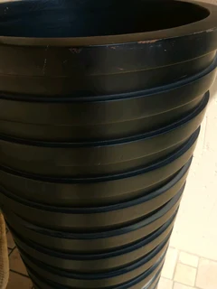 A beautiful full length designer vase, brand new slightly shop soiled. H135/W45