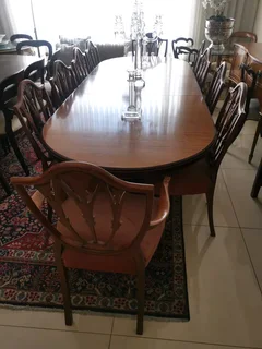An elegant antique 10 seater dinning suite with a server in exceptional condition.