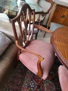 An elegant antique 10 seater dinning suite with a server in exceptional condition.