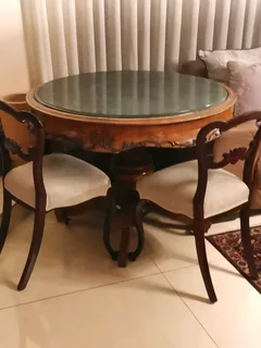 An ornate antique dinning/entrance table. In rare green marble top.