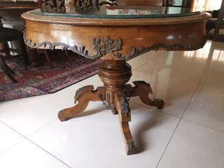 An ornate antique dinning/entrance table. In rare green marble top.