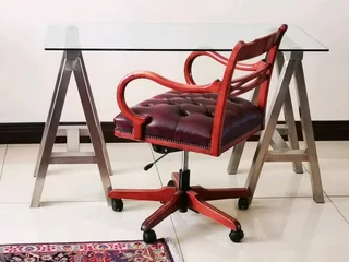 Glass table on heavy metal trusses, made with quality material. Dimensions are W126/H77/D60