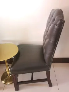 Opulent office/dinning genuine leather buttoned formal chairs.