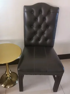 Opulent office/dinning genuine leather buttoned formal chairs.