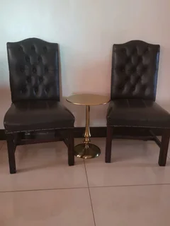 Opulent office/dinning genuine leather buttoned formal chairs.