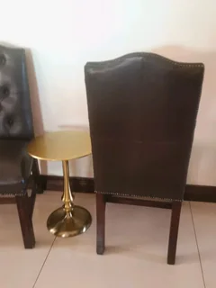 Opulent office/dinning genuine leather buttoned formal chairs.