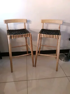 Quality beach wood designer bar stools in exceptional condition, sold per each.