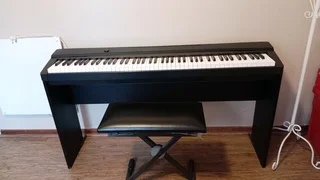 Casio digital piano with wooden stand and stool