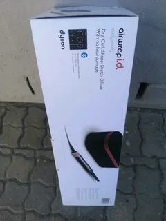 Dyson Airwrap i.d Multi-Styler  Dryer Straight Wavy Brand New Sealed In The Box Never Been Used.
