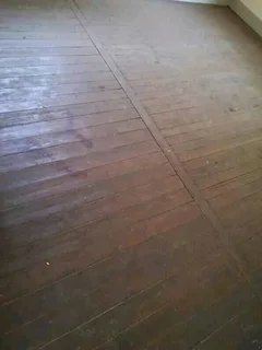 Stripping of old wooden floors and replacing with concrete floors