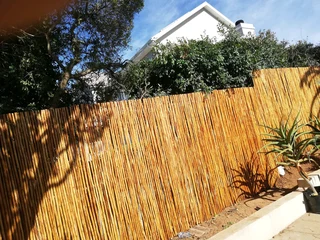 Wooden fence latle, bamboo and Roll on grass