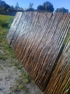 Wooden fence latle, bamboo and Roll on grass