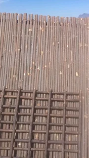 Wooden fence latle, bamboo and Roll on grass