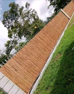 Wooden fence latle and Roll grass