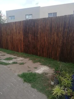 Wooden fence latle bamboo and Roll on grass
