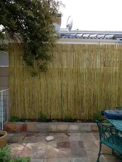 Wooden fence latle bamboo and Roll on grass