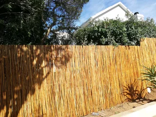 Wooden fence latle bamboo and Roll on grass